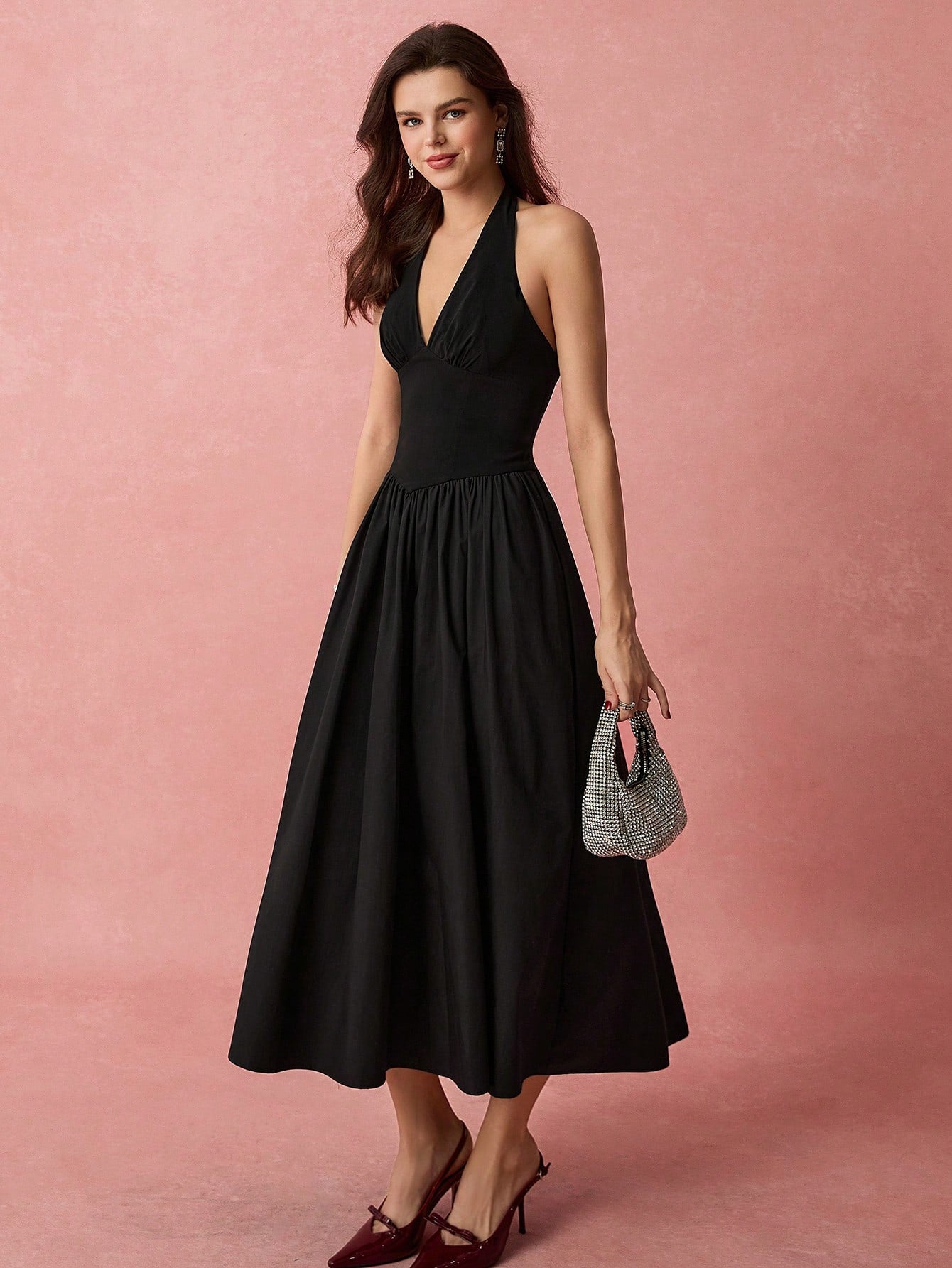 Get ready to turn heads in this elegant black halter neck A-line dress! Perfect for romantic occasions or everyday wear, this dress is sure to make you feel confident and stylish. With a flattering A-line silhouette and a classic halter neckline, this dress is a must-have addition to your wardrobe.