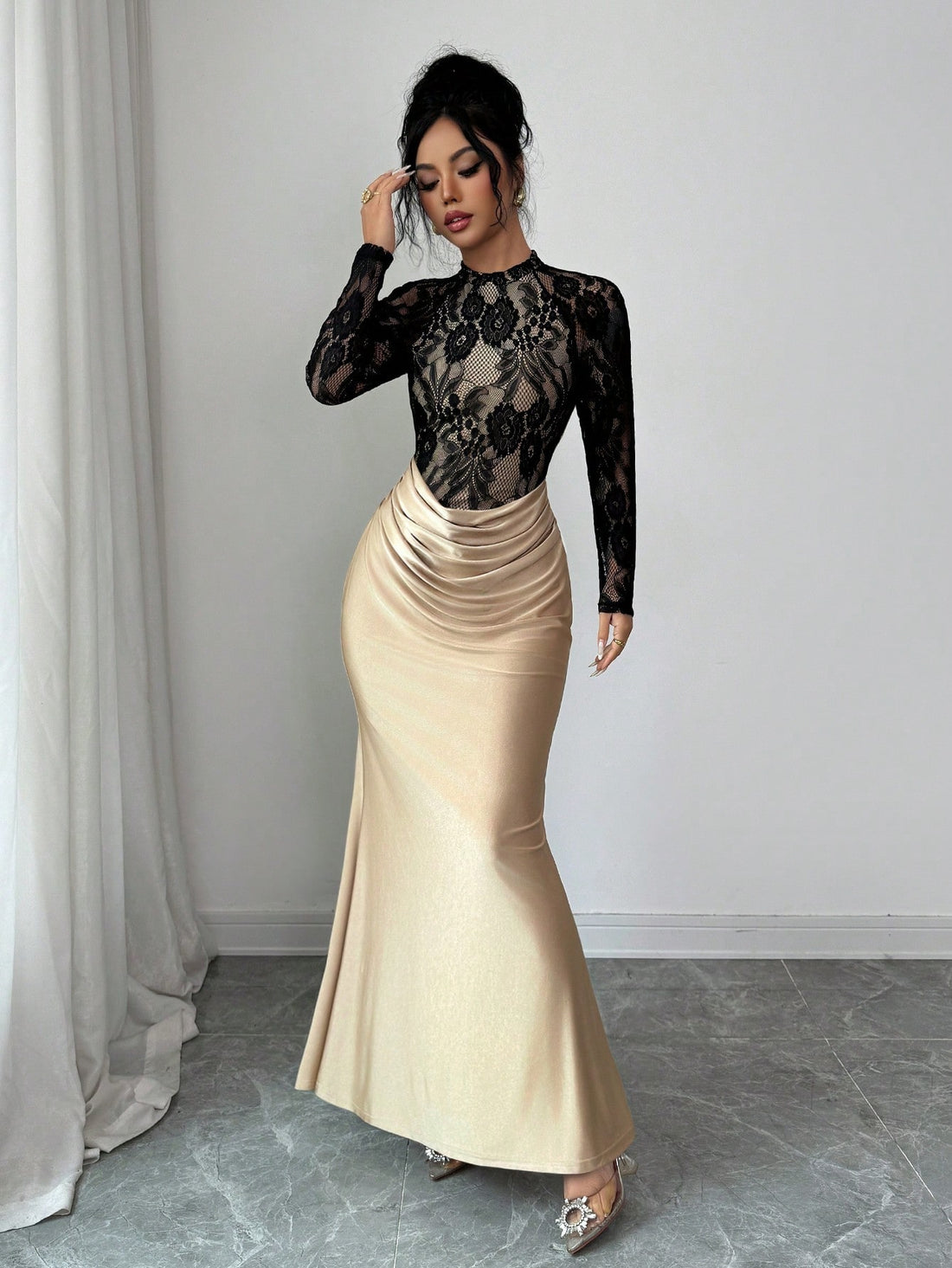 Turn heads at your next celebration in this stunning black lace fishtail dress. The intricate lace detailing creates an air of sophistication, while the dramatic fishtail silhouette adds a touch of glamour and movement. Perfect for autumn and winter galas, holiday parties, or any special occasion where you want to feel absolutely fabulous. The elegant black hue pairs effortlessly with your favorite heels and accessories, making it a versatile addition to your evening wardrobe. Slip into pure elegance and le