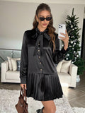 Elevate your party game with this stunning black pleated mini dress that's equal parts sophisticated and fun. The charming tie collar adds a flirty touch, while long sleeves keep things polished and put-together. Perfectly pleated throughout for a flattering silhouette that moves with you, this dress transitions seamlessly from evening events to upscale casual outings. Whether you're dancing the night away or making a chic entrance, this wardrobe essential delivers timeless elegance with a playful edge.