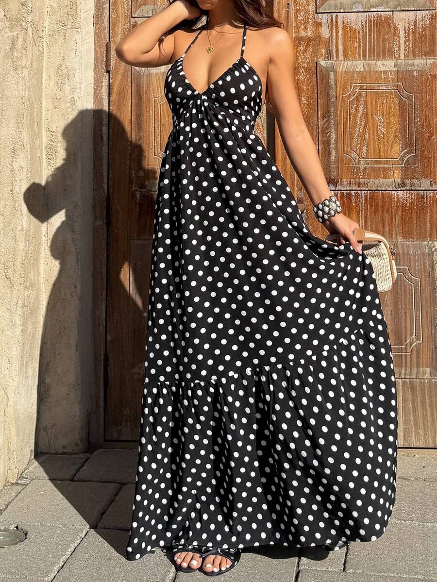 Make a statement this season in our Elegant Black Polka Dot Deep V Neck Halter Maxi Dress. Featuring a flattering halter neckline, backless design, and high-waisted A-line silhouette, this boho-inspired piece is perfect for beach getaways and vacation adventures. The ruffle hem and flounce detailing add movement and charm, while the sleeveless cut keeps you cool. Crafted from a breathable 97% polyester and 3% elastane blend, this versatile dress transitions effortlessly from day to night. Machine washable f