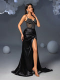 Step into the spotlight with this Elegant Black Rhinestone Split-Thigh Cami Party Dress. Sparkling rhinestones catch every eye, while the daring split thigh adds a flirty touch. Perfect for turning heads at formal events or special occasions, this dress combines glam and confidence in one stunning look. Get ready to dance the night away and own every moment!