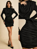 Make a statement this season in our stunning black ruched mini dress—where sophistication meets fun. The flattering ruched detailing sculpts your silhouette while the crisp stand collar and long sleeves add an unexpected edge. Whether you're ringing in the New Year or hitting the party scene, this versatile piece transitions effortlessly from evening events to night-out moments. The mini length keeps things flirty and modern, while the sleek black hue pairs with everything in your closet. Dress it up with h