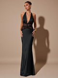 Make a statement at your next formal occasion in this sophisticated black satin fishtail dress. The plunging V-neckline creates an alluring silhouette, while delicate lace patchwork details add refined texture and visual interest. The signature fishtail hem provides elegant movement and a flattering drape that elongates the frame. Crafted from luxurious satin, this versatile piece transitions seamlessly from cocktail parties to black-tie events. Style with minimal jewelry to let the dress's architectural de