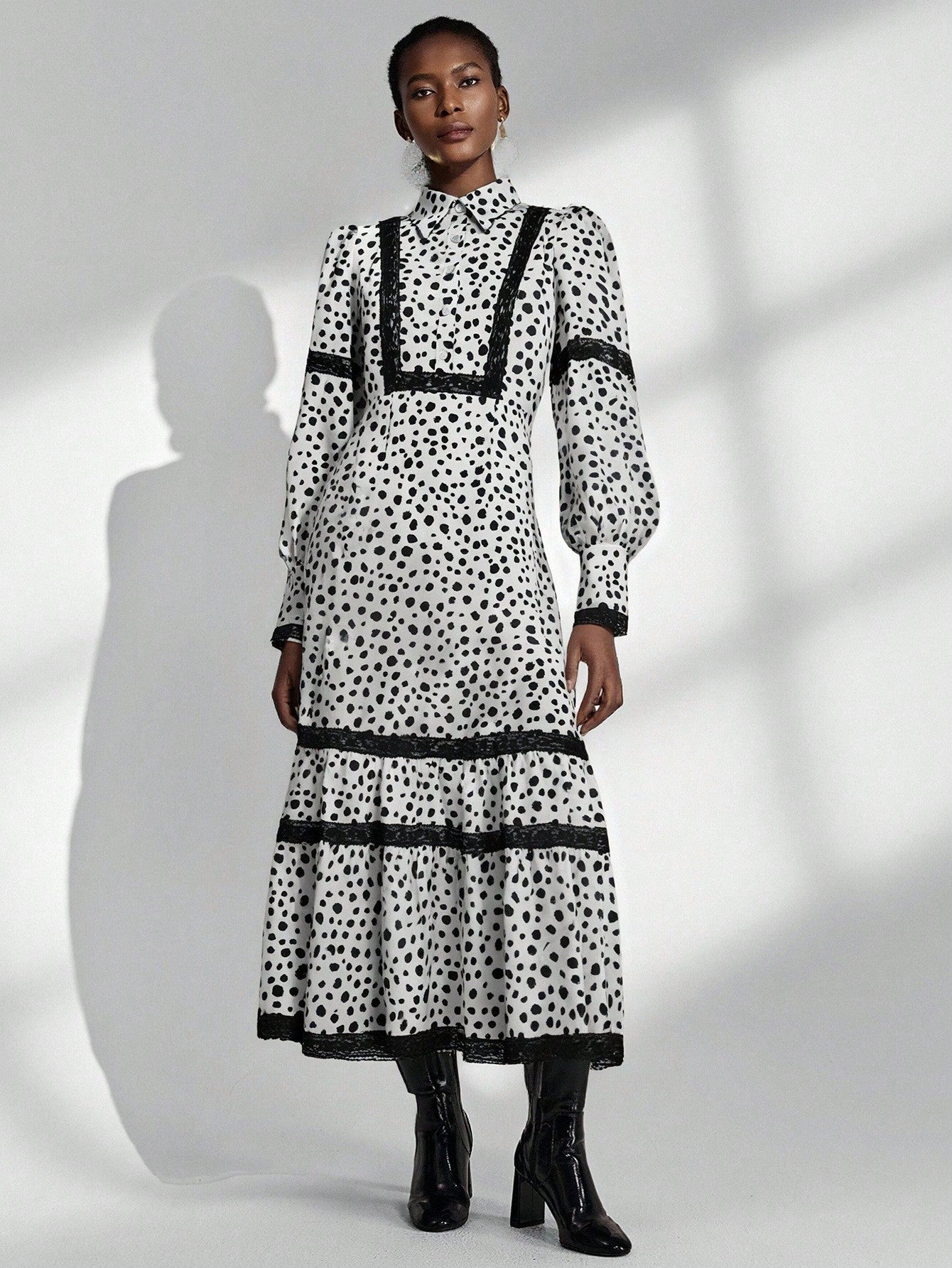 Twirl into timeless elegance with this charming black and white polka dot dress! Featuring delicate lace trim and a flattering flared silhouette inspired by classic French style, this piece effortlessly transitions from casual outings to special occasions. The playful polka dot pattern adds a touch of whimsy while the sophisticated color palette keeps it refined. Perfect for anyone seeking a dress that balances vintage charm with modern flair—because sometimes the sweetest style moments come in the smallest