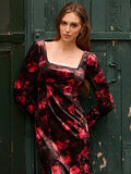 Step into autumn elegance with this stunning velvet midi dress that's equal parts sophisticated and fun. The rich black base showcases gorgeous red floral details, while the square neckline adds a modern touch of charm. Delicate lace trim frames the design beautifully, creating an effortlessly chic silhouette perfect for evening gatherings, date nights, or whenever you want to feel absolutely fabulous. The luxurious velvet fabric drapes gracefully, ensuring you'll turn heads while staying cozy through those