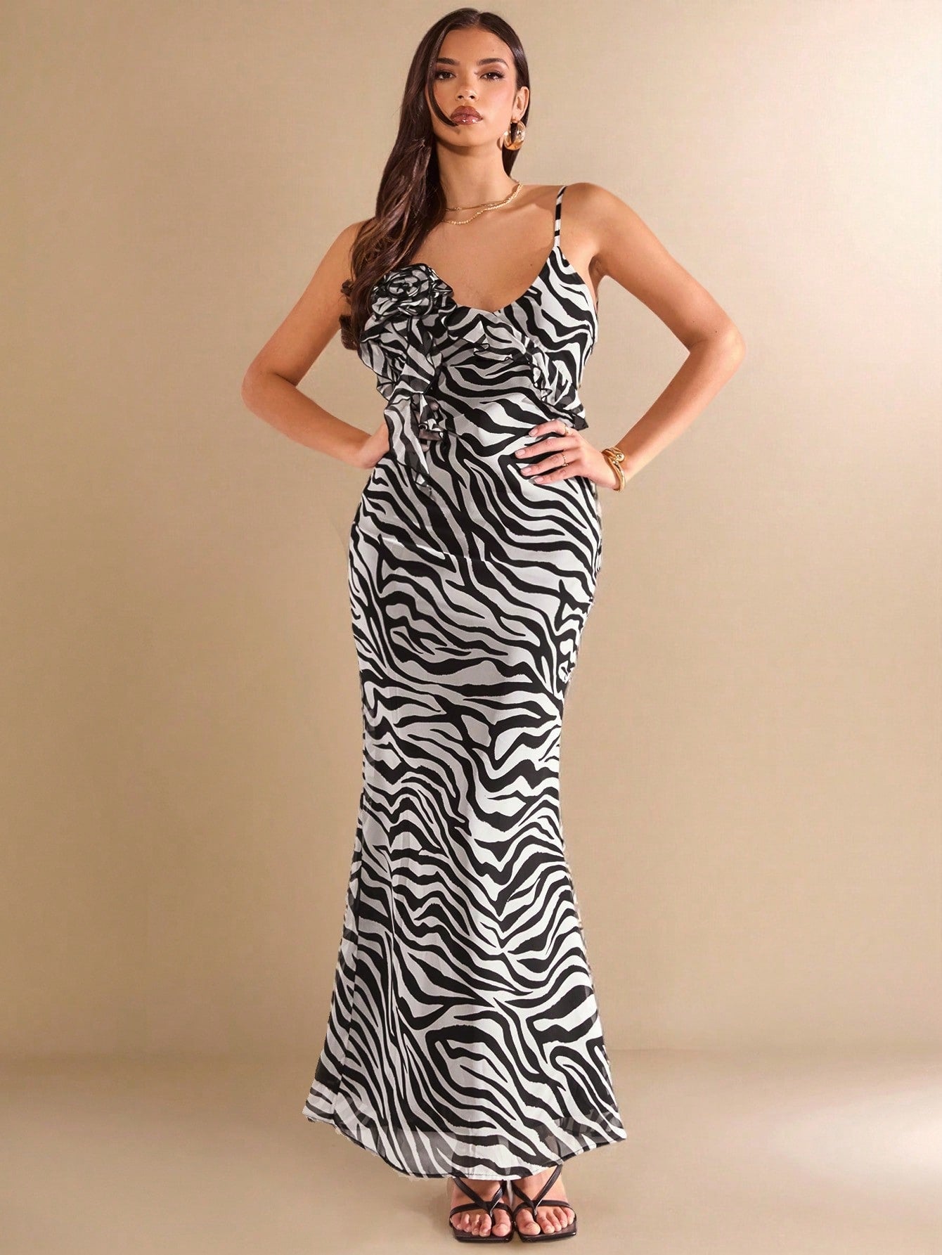 Unleash your wild side with this elegant black and white zebra print backless dress! Perfect for spring and summer vacations, its unique 3D floral ruffles add a touch of whimsy to your wardrobe. Let this dress be your statement piece and turn heads wherever you go!