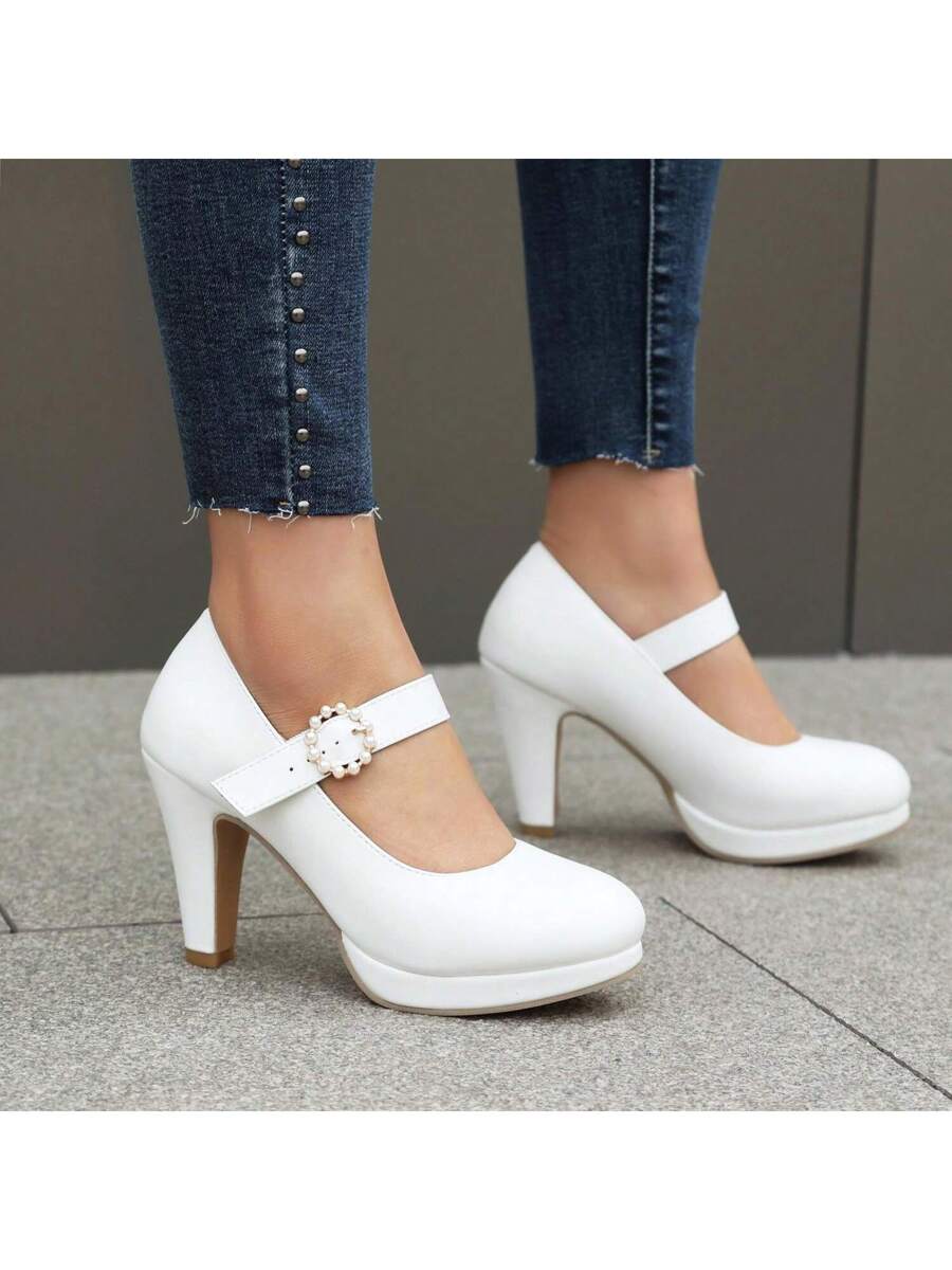 Step into sophistication with these elegant block high heels, designed to elevate your everyday look. Featuring a charming faux pearl accent and sturdy chunky heel, these Mary Jane-style pumps offer the perfect balance of comfort and style. The round toe and buckle strap provide a secure, flattering fit, while the premium PU leather upper ensures durability and a polished appearance.