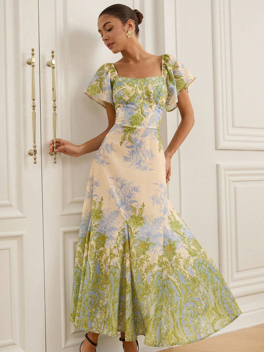 Escape to paradise in this stunning blue-green floral print dress that's practically begging for a vacation! The delicate flutter sleeves add a touch of whimsy and movement, while the vibrant botanical pattern brings instant joy to your wardrobe. Whether you're lounging by the pool, exploring a charming coastal town, or dressing up for a sunset dinner, this versatile beauty transitions effortlessly from day to night. The flattering silhouette and breezy fabric make it your new go-to for warm-weather adventu