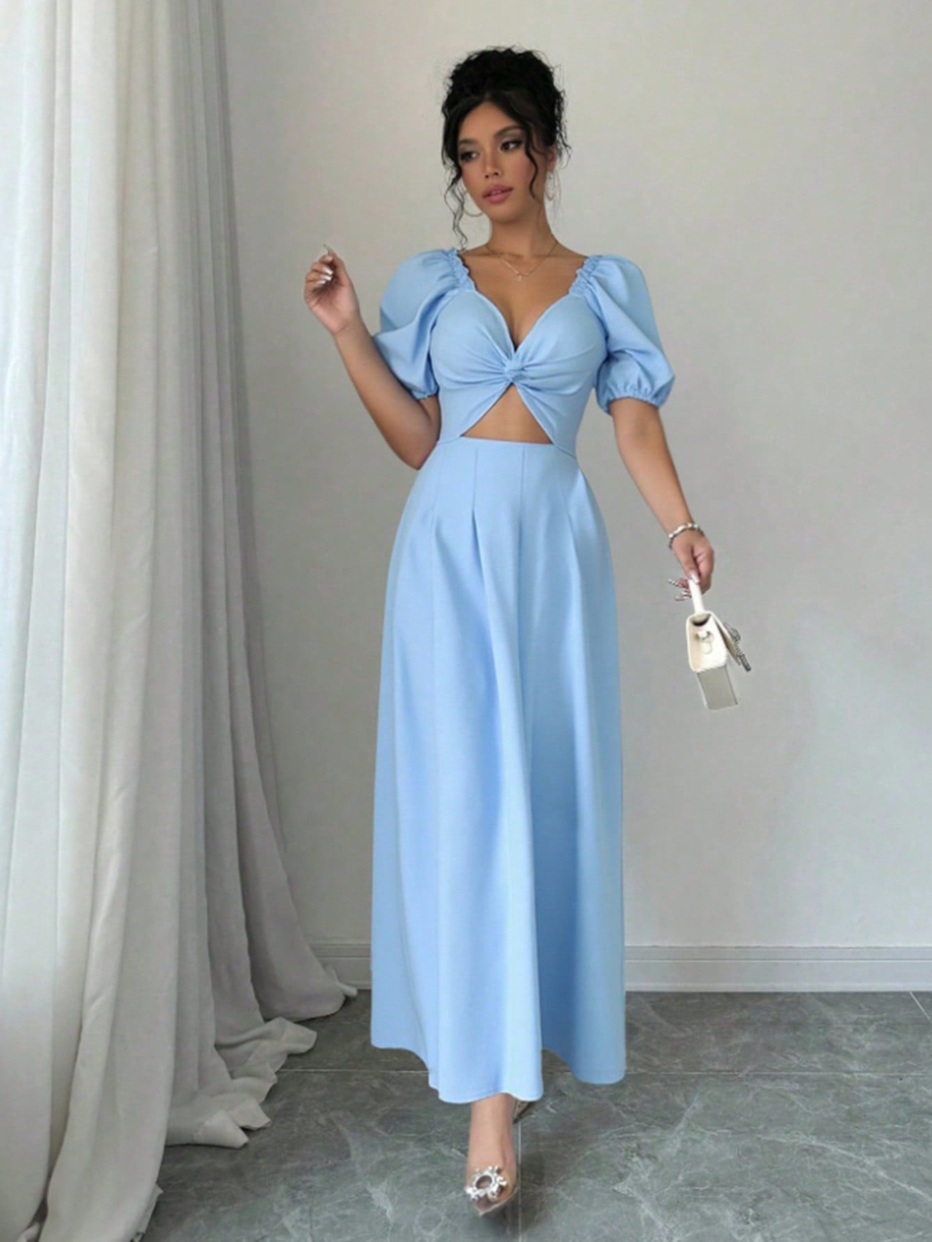 Turn heads in this elegant blue puff sleeve evening gown, designed to make a statement at romantic parties. The playful puff sleeves add a touch of whimsy to the classic silhouette, making it the perfect choice for a fun night out. Feel confident and stylish in this must-have gown!