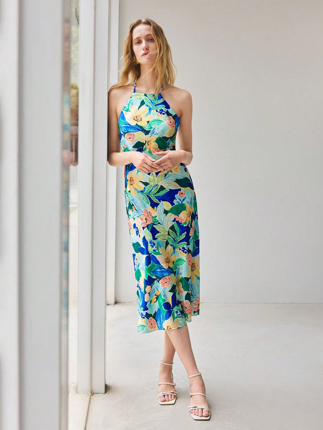 Slip into effortless summer style with this stunning blue satin sundress, where delicate florals meet luxe fabric for a look that's equal parts sophisticated and fun. Perfect for lazy beach days, festival adventures, or any occasion calling for that "I woke up like this" vibe. The flowing silhouette keeps you cool and comfortable while the rich satin finish catches the light beautifully. Whether you're dancing under the stars or sipping cocktails by the ocean, this dress is your go-to companion for making m