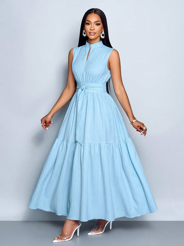 Elevate your style game with this playful blue sleeveless dress! The stand collar adds a touch of sophistication, while the cinched waist and tie knot detail create a flattering silhouette that's sure to turn heads. Perfect for sunny days, special occasions, or whenever you want to feel fabulous without trying too hard!