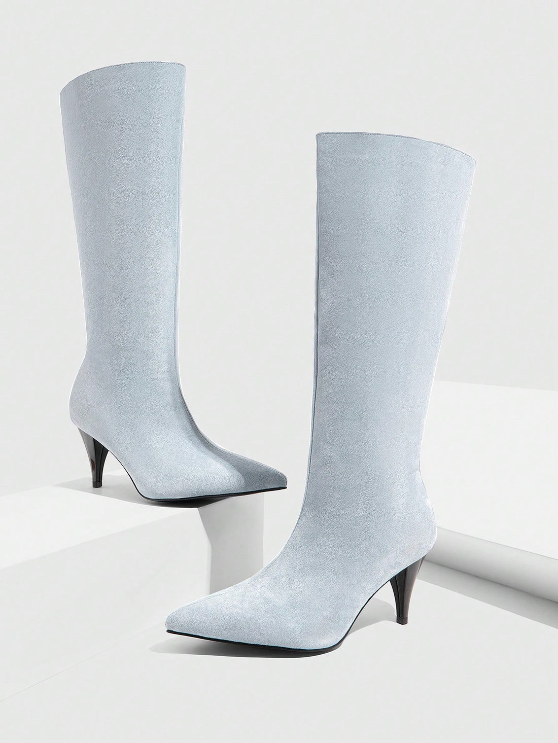 Be the belle of the office (shh, no need to tell them about festive occasions) in our Elegant Blue Velvet Pointed Toe Mid Heels! These stylish commuter boots exude sophistication and are perfect for both work and play. With a comfortable mid heel and luxurious velvet material, you'll be strutting your stuff in style.
