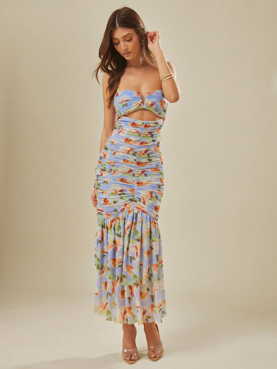 Make a statement with our Elegant Blue and White Floral Maxi Dress for Women. Designed with a feminine bustier and flattering ruching, this dress will accentuate your curves and make you stand out. The delicate ruffles add a playful touch to this elegant piece. Perfect for any occasion!