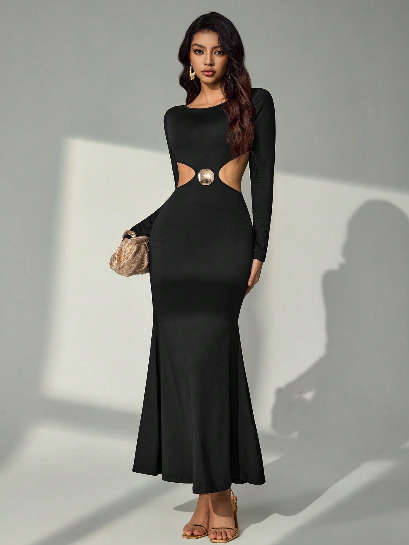 Elevate your seasonal wardrobe with this stunning Bluhae long dress, where sophistication meets a hint of flirtation. The pleated silhouette creates graceful movement, while strategic metal-adorned cutouts add an unexpected edge to the design. Perfect for spring gatherings or autumn evenings, this piece transitions effortlessly from casual outings to special occasions. The elegant draping flatters your figure, and the metallic accents catch the light beautifully. Whether you're dressing up for a night out o