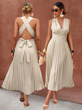 Front view of apricot sleeveless pleated midi dress with wrap V-neck and high waist