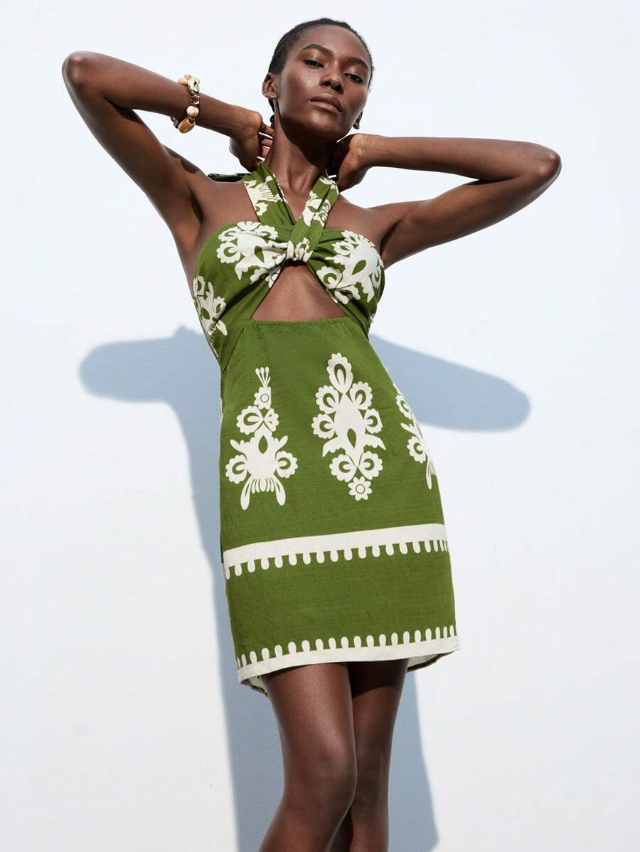 Step into autumn beach days with this playful Bohemian mini dress, featuring a chic twist halter neckline and a flirty hollow waist. The floral pattern adds a burst of color and free-spirited charm, while its lightweight fabric keeps you cool and comfortable. Perfect for breezy seaside strolls or sunset gatherings, it blends elegance with a fun, carefree vibe. Make every beach moment a stylish escape!
