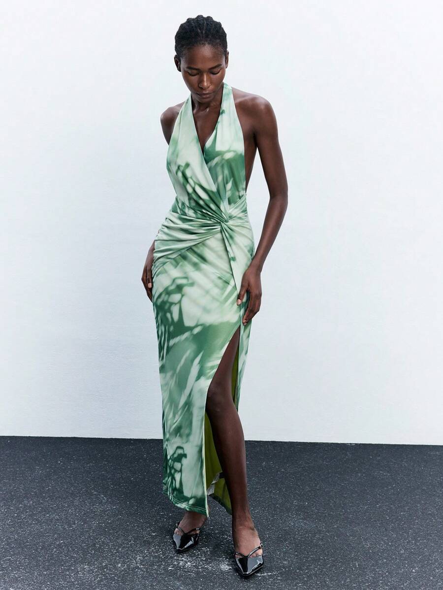 Dive into effortless elegance with this stunning tie-dye halter maxi dress—your new go-to for beach weddings, tropical getaways, and sun-soaked celebrations. The flowing silhouette and vibrant bohemian patterns create an enchanting look that turns heads while keeping you cool and comfortable. With its flattering halter neckline and graceful maxi length, you'll feel like a free-spirited goddess ready to dance under the stars. Perfect for creating unforgettable moments in style.