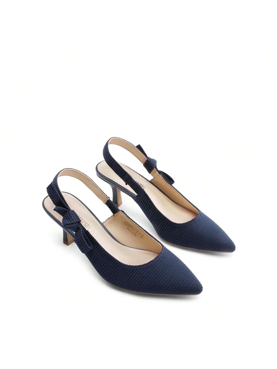 Step into sophistication with these charming slingback kitten heels, where delicate bow details meet timeless elegance. Perfect for weddings, galas, and those moments when you want to feel fabulous without sacrificing comfort, these pumps strike the ideal balance between style and wearability. The graceful kitten heel provides just enough lift to elongate your silhouette while keeping your feet happy all evening long. Whether you're dancing at a reception or mingling at a cocktail party, these beauties deli