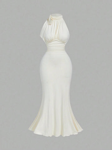 Turn heads in this Elegant Bowknot Neck Ruched Bodycon Dress with a flirty mermaid hem. The charming bowknot neckline adds a hint of whimsy,