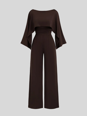 Front view of dark brown cape-sleeve wide-leg jumpsuit with a ruched high waist