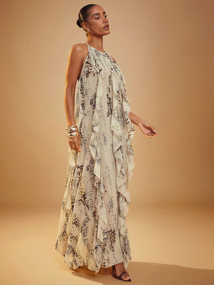 Step into summer fun with this playful brown leopard print maxi dress. Featuring a flirty halter neck and charming ruffles, it blends wild style with breezy comfort. Perfect for lively parties or relaxed outings, this dress adds a dash of bold elegance wherever you go.