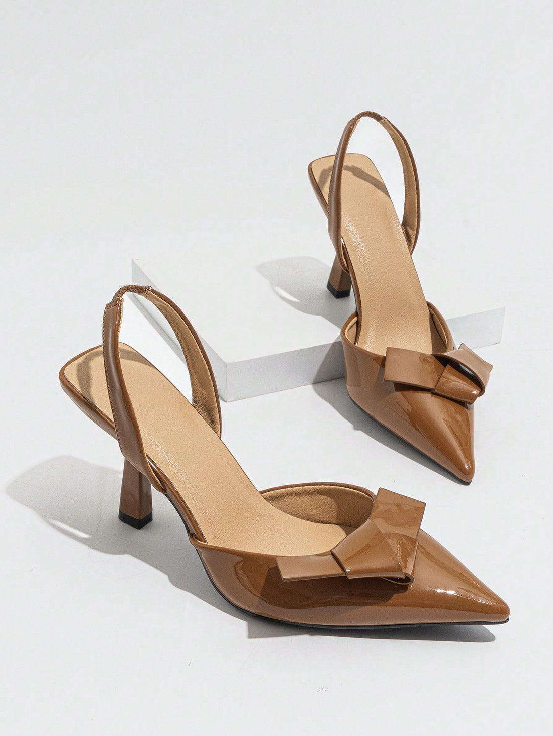 Step into the spotlight with these elegant brown pointed toe high heels, designed to add a playful twist to your spring and summer party looks. Featuring charming bows and secure ankle straps, they blend sophistication with a flirty vibe. Perfect for dancing the night away or turning heads at any event, these heels bring both style and confidence to your wardrobe.