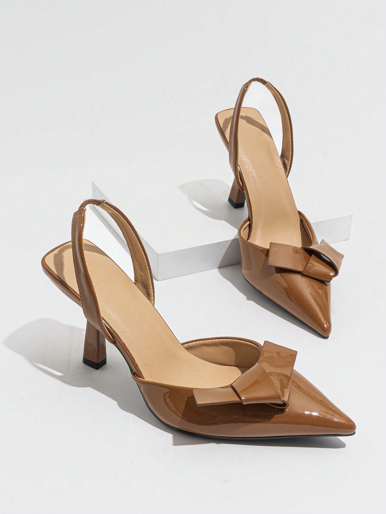 Step into the spotlight with these elegant brown pointed toe high heels, designed to add a playful twist to your spring and summer party looks. Featuring charming bows and secure ankle straps, they blend sophistication with a flirty vibe. Perfect for dancing the night away or turning heads at any event, these heels bring both style and confidence to your wardrobe.