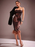 Turn heads this winter in our Elegant Brown Strapless Midi Dress, featuring a chic feather trim that brings a touch of whimsy to your party or concert look. The strapless design lets you flaunt your shoulders with confidence, while the midi length keeps your style sophisticated and warm. Perfect for dancing the night away or cozying up with friends, this dress combines comfort and flair in one unforgettable outfit.