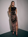 Slip into sophistication with this stunning brown velvet gown that's ready to turn heads at any autumn soirée. The luxurious velvet fabric drapes beautifully while the pleated waistband cinches your silhouette with effortless elegance. Flowy side slits add a playful touch of movement and allure, making every step feel like a red carpet moment. Perfect for formal events, evening galas, or whenever you want to feel absolutely fabulous. This dress proves that timeless style never goes out of season.