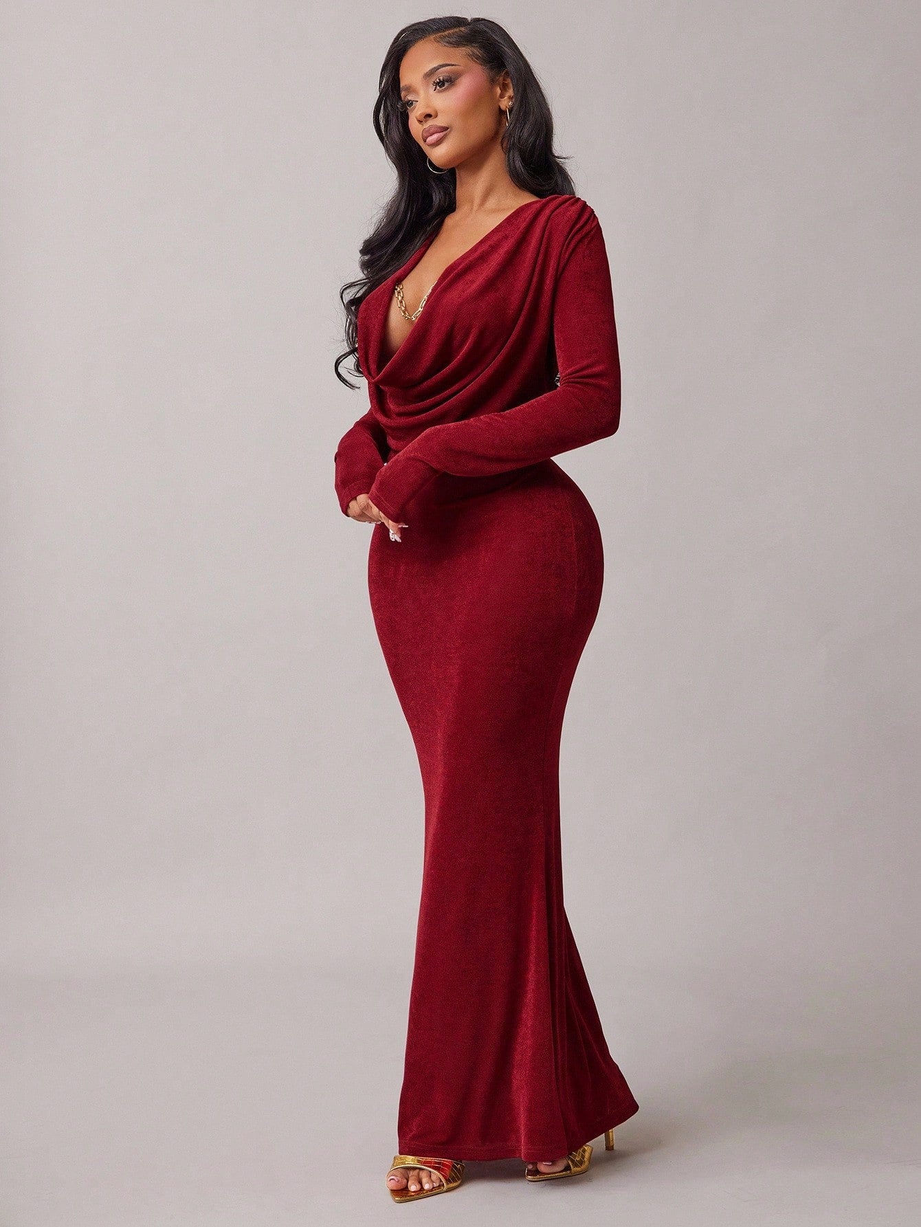 Make a statement in this stunning burgundy fishtail dress that turns heads at every occasion. The rich, luxurious color flatters all skin tones, while the dramatic fishtail hem adds a touch of glamour and movement. Whether you're attending a formal gala, celebrating at a holiday party, or dancing the night away, this dress delivers elegance with a fun, flirty twist. The fitted silhouette hugs your curves beautifully, creating a show-stopping look that feels both sophisticated and playfully confident. Perfec
