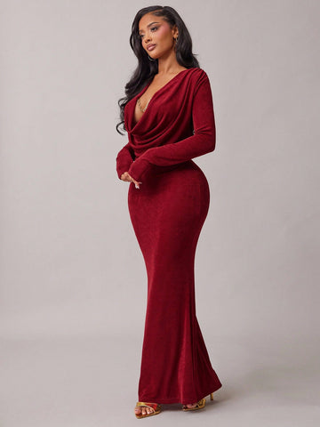 Make a statement in this stunning burgundy fishtail dress that turns heads at every occasion. The rich, luxurious color flatters all skin tones, while the dramatic fishtail hem adds a touch of glamour and movement. Whether you're attending a formal gala, celebrating at a holiday party, or dancing the night away, this dress delivers elegance with a fun, flirty twist. The fitted silhouette hugs your curves beautifully, creating a show-stopping look that feels both sophisticated and playfully confident. Perfec