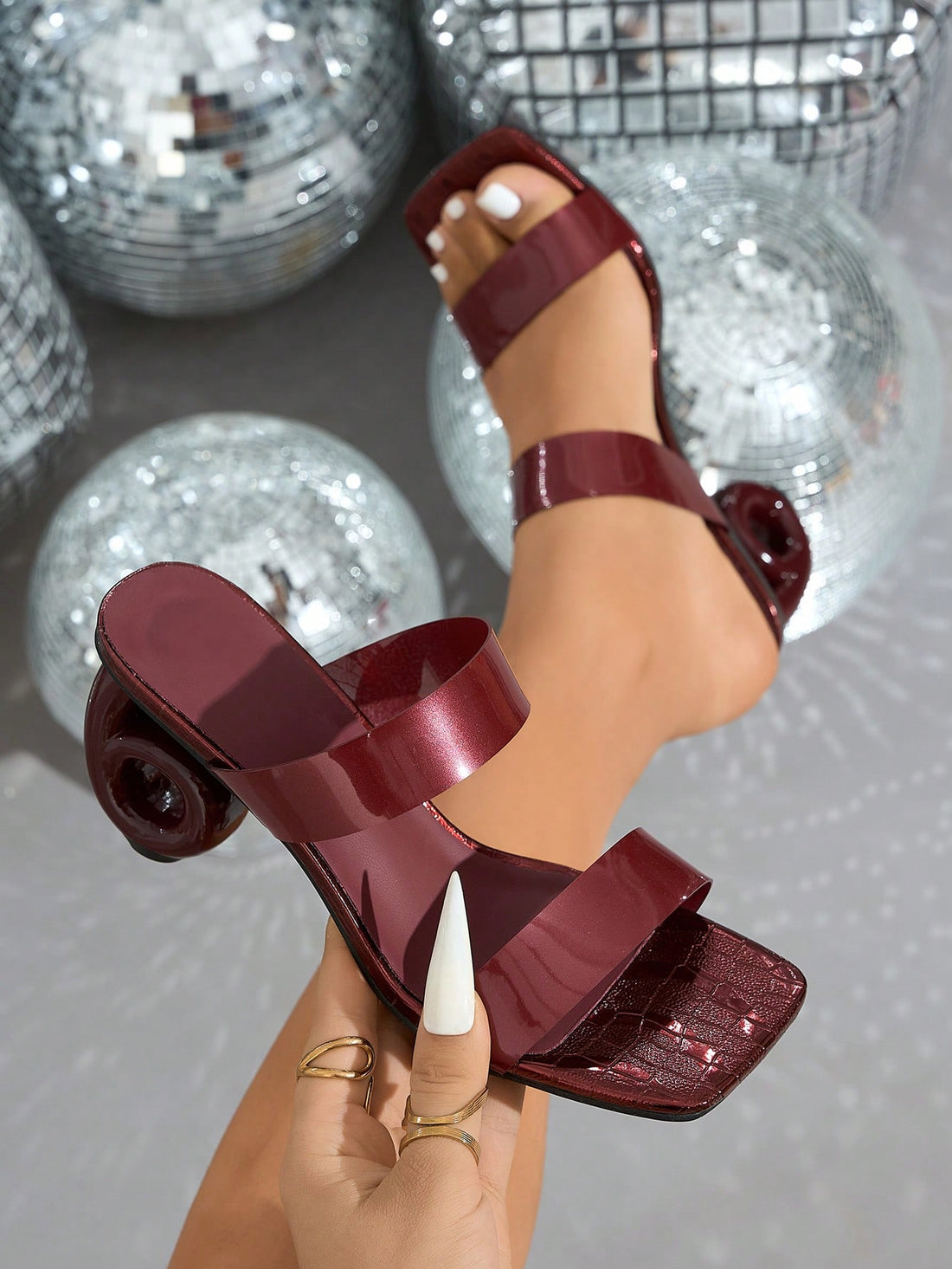Step into sophistication with these stunning burgundy high heels, where modern design meets timeless elegance. The asymmetric square toe adds an unexpected twist that sets you apart from the crowd, while the rich burgundy hue complements any outfit from cocktail dresses to date night ensembles. Crafted for those who refuse to compromise on style, these heels deliver the perfect balance of bold fashion and wearable comfort. Whether you're dancing at a party or making an entrance on a special evening, these b