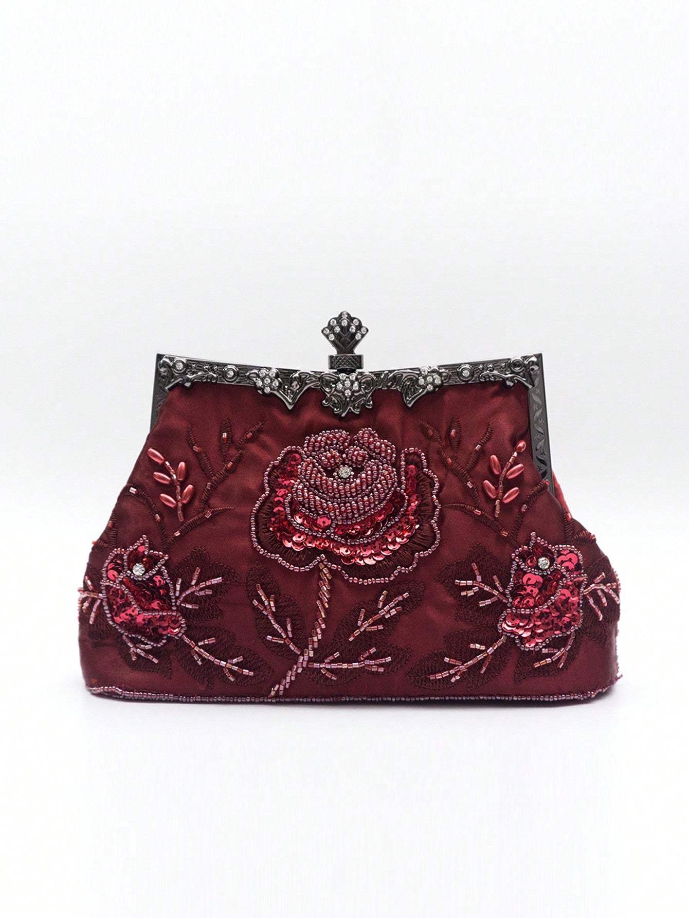 With beautiful burgundy rose embroidery and a vintage 1920s style, this elegant evening clutch is the perfect accessory for formal events. The intricate beadwork exudes timeless sophistication, making it a must-have for any wardrobe. Elevate your look and make a statement with this stunning purse.