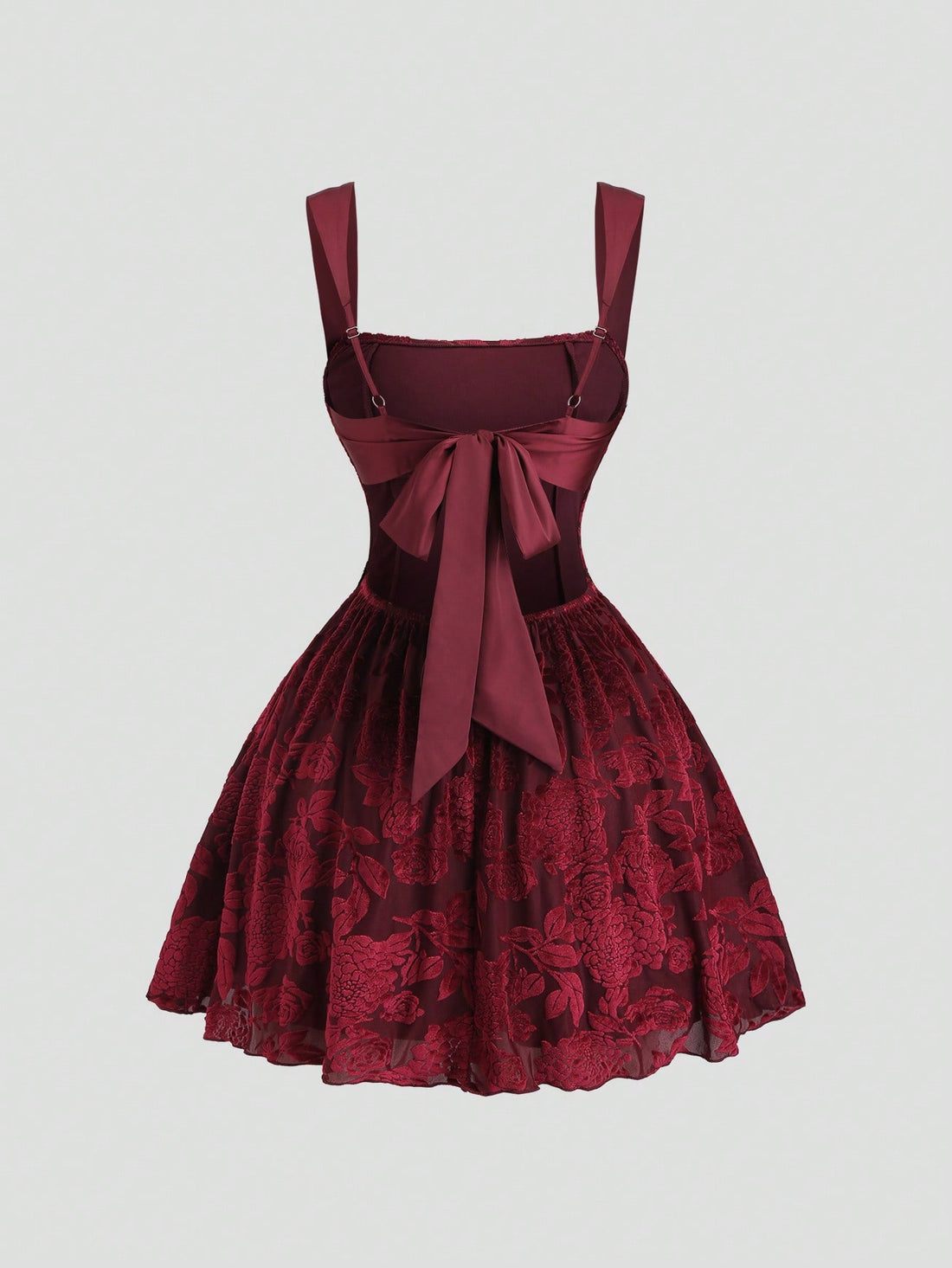 Step into the spotlight with this show-stopping burgundy velvet dress that blends vintage charm with modern flair. Featuring a stunning floral patchwork design and daring backless silhouette with delicate lace-up detailing, this piece transforms any celebration into a glamorous affair. The rich velvet fabric drapes beautifully while the intricate patchwork adds artistic depth and personality. Perfect for holiday parties, special events, or whenever you want to make a memorable entrance. Dress it up with hee
