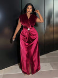 Turn heads in this Elegant Burgundy Velvet Maxi Dress, perfect for formal occasions. With its sleeveless V-neck design and daring slit hem, it combines sophistication with a hint of fun. The metal buckle detail adds a playful twist, making every step feel like a grand entrance. Feel confident and chic all night long!