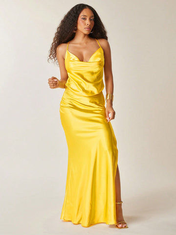 Step into sunshine with this butter yellow satin maxi dress, designed to turn heads at any summer wedding. Its low cowl neck adds a touch of flirtiness, while the high slit lets you show off your dance moves with ease. Lightweight and silky, it’s the perfect blend of elegance and fun for warm-weather celebrations.
