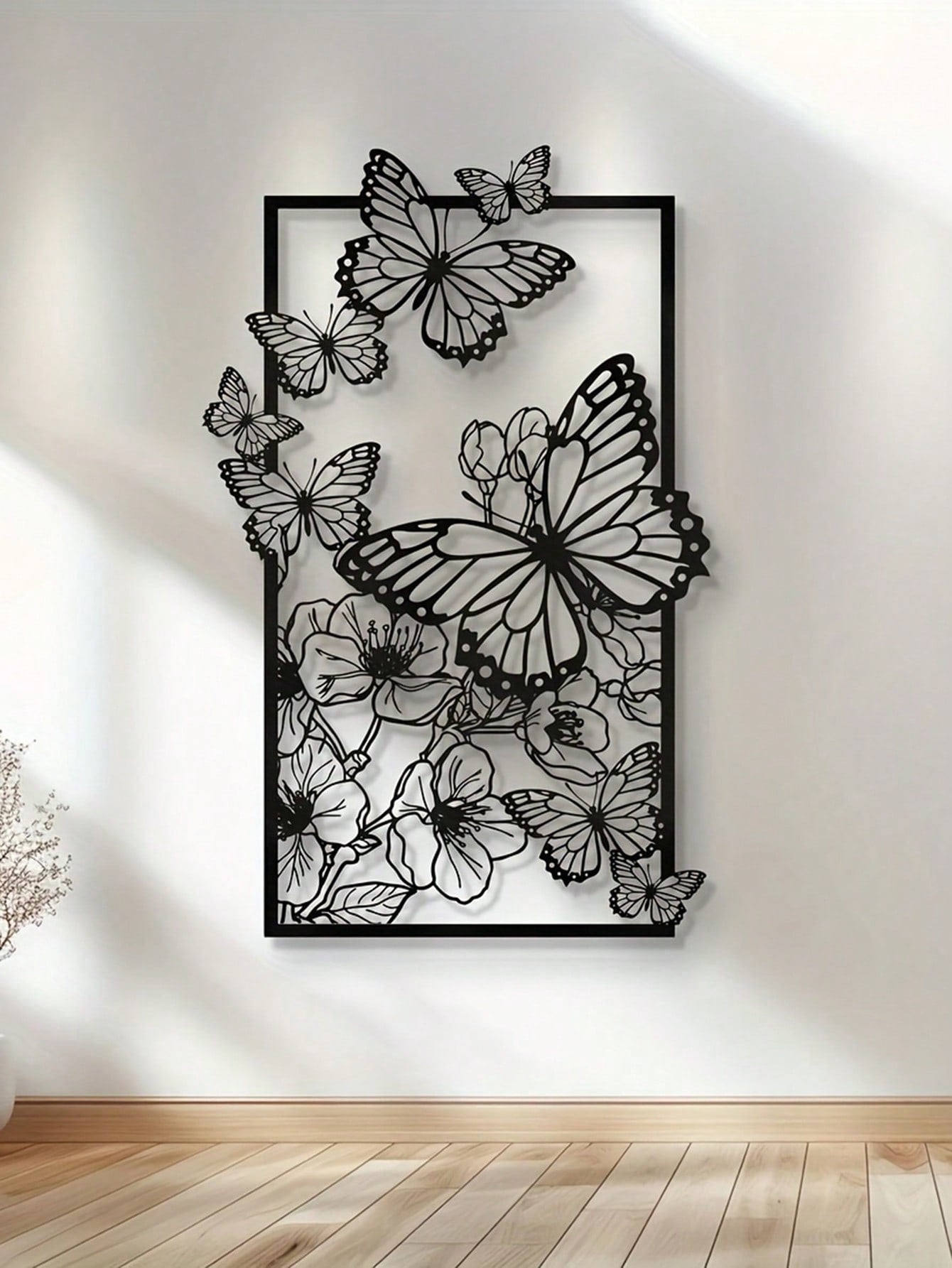 Enhance your home decor with this elegant Butterfly & Floral Metal Wall Sculpture. Delicate and modern, it adds a unique touch to any wall. Perfect for animal lovers, it also makes a thoughtful gift. Fluttering butterflies and blooming flowers make this sculpture a beautiful addition to any space.