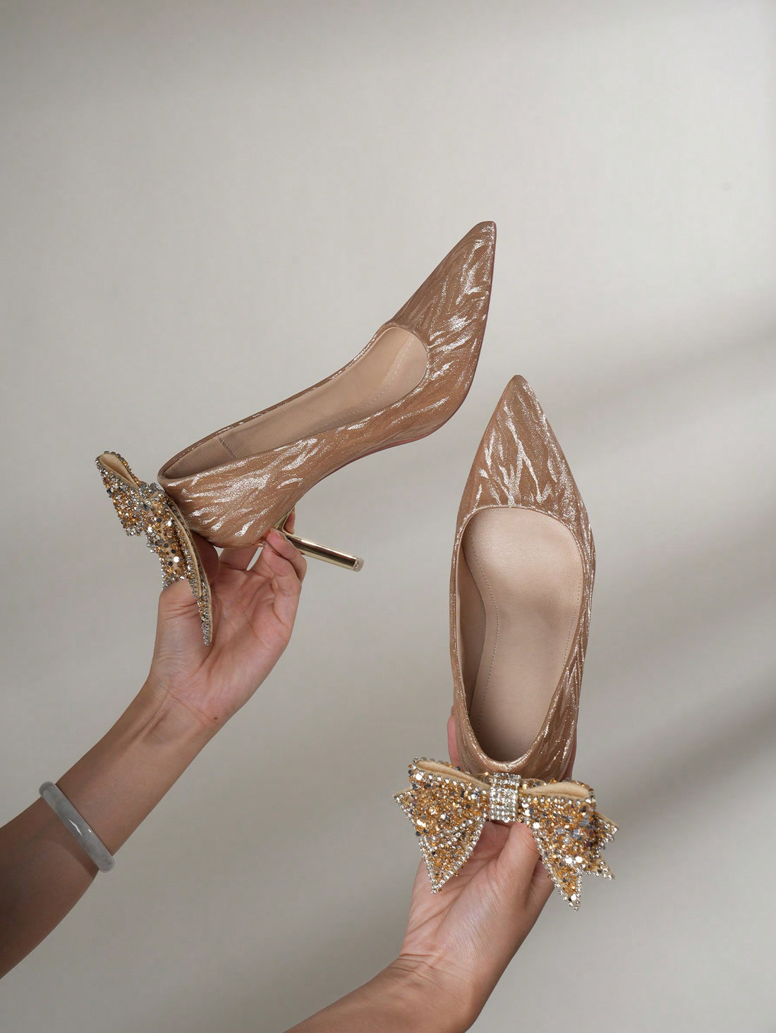 Add some sparkle to any special occasion with these Elegant Champagne Sequin Stiletto Pumps! The beautiful bowknot detail adds a touch of elegance, making them perfect for weddings and other special events. These pumps will have you feeling chic and glamorous.