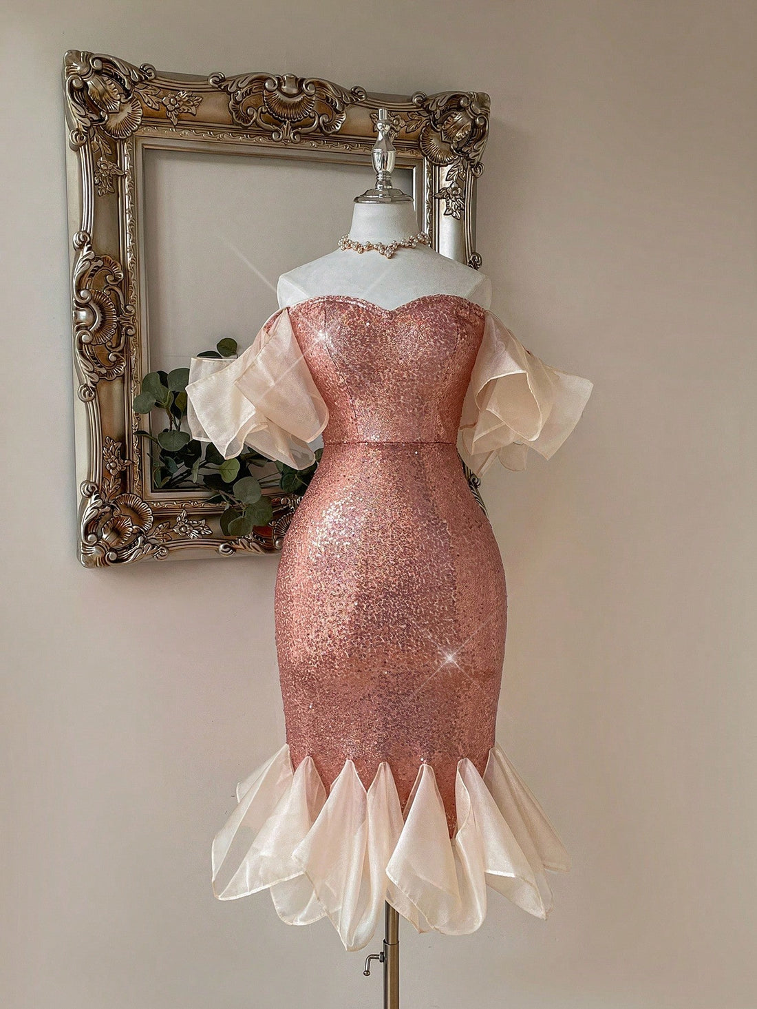 Turn heads at your next event with this playful champagne sequined fishtail bodycon dress. Its shimmering sequins catch the light beautifully, while the asymmetrical puff sleeves add a fun, flirty touch. The fishtail silhouette hugs your curves and flares out gracefully, perfect for dancing the night away in style. Ideal for special occasions when you want to sparkle with confidence and charm.