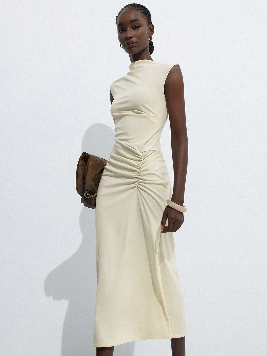 Step out in style with this Elegant Chic Long Dress, featuring playful ruffled sleeves and a flattering ruched waist design. The side slit adds a touch of allure while keeping it perfect for your daily commute. Comfortable and stylish, it’s your go-to dress for turning heads with effortless charm.