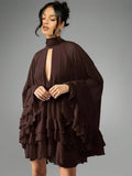 Turn heads effortlessly in this chiffon cape mini dress, designed with a playful high neck keyhole and charming tiered ruffle hem. Its light, flowing fabric adds movement and grace, perfect for making every special occasion feel unforgettable. Embrace a mix of elegance and fun with this standout piece that’s as spirited as you are.