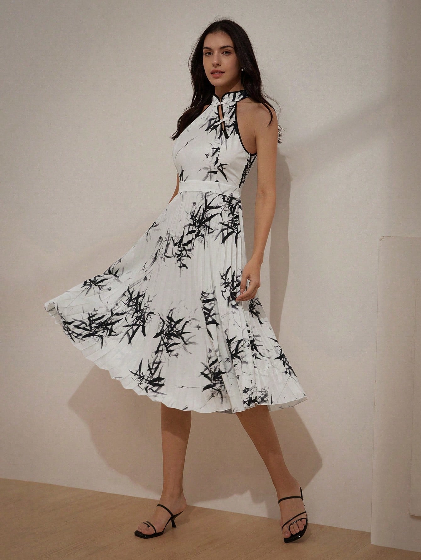 Get ready to turn heads this summer with our Elegant Chinese-Style Summer Dress! Featuring a sleeveless vest and a unique bamboo leaf print, this dress will add a touch of exotic elegance to your wardrobe. Perfect for any occasion, this dress will have you feeling stylish and confident all season long.