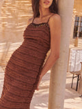 Slip into sophistication with this chocolate brown midi dress that's anything but boring. The textured ruched fabric creates flattering dimension while the beaded neckline adds just the right amount of sparkle to turn heads. Perfect for date night, special occasions, or whenever you want to feel absolutely fabulous. This dress proves that elegance doesn't have to be serious—it can be fun, flirty, and totally you.