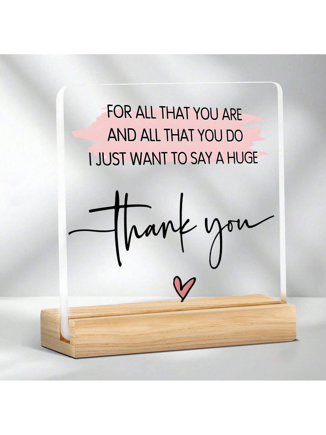 This decorative plaque is a charming way to show your appreciation for any occasion. With an elegant clear acrylic design and included wooden stand, it's both stylish and versatile. A perfect gift that's sure to impress (without breaking the bank)!