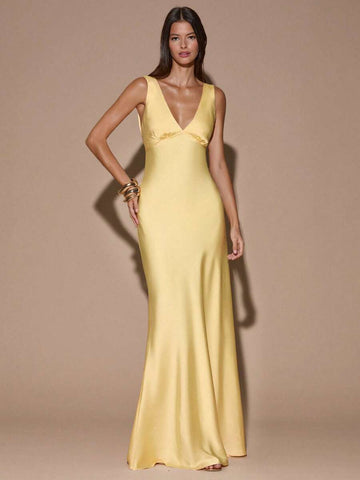 Pale yellow satin maxi dress with deep V neckline and wide straps