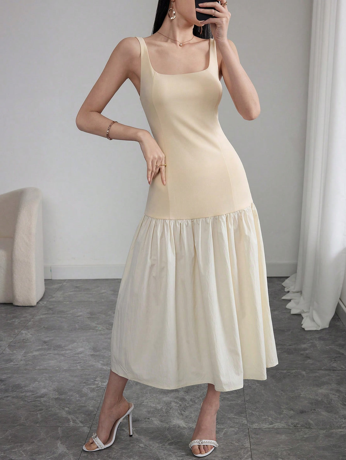 Be the belle of the ball in this elegant sleeveless midi dress. The stylish colorblock design is sure to turn heads and the chic silhouette will flatter your figure. Perfect for any occasion, this dress will elevate your wardrobe and make you feel like a fashionista (without breaking the bank).