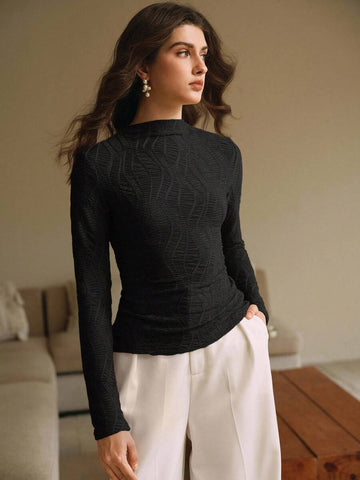 Elevate your everyday commute with this chic brown fitted tee that's anything but basic. The delicate pleating adds sophisticated texture and movement, while the round neckline keeps things effortlessly polished. Perfect for layering or wearing solo, this wardrobe essential transitions seamlessly from office to weekend plans. Crafted for the modern woman who refuses to compromise on style, even when she's just grabbing her morning coffee.