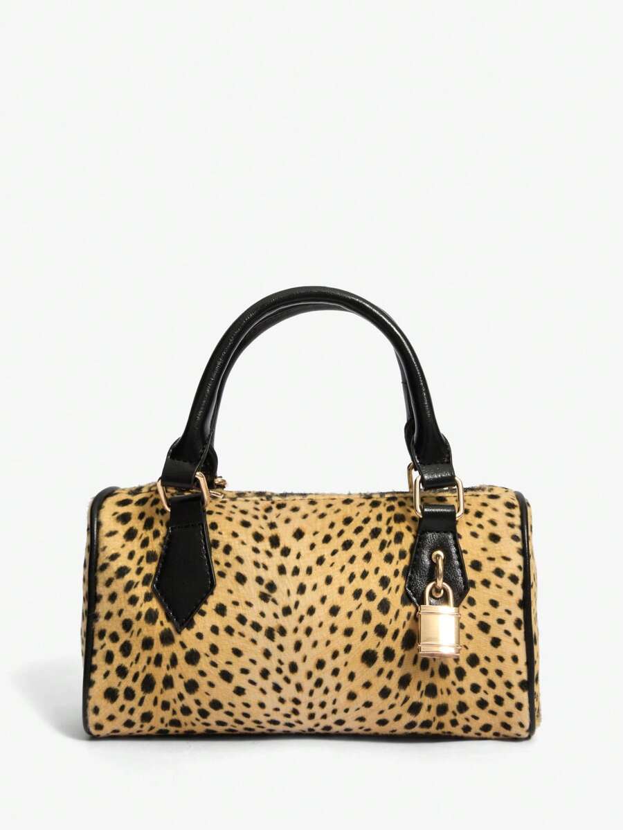 Moo-ve over, basic bags! This chic cow print top handle bag brings a playful twist to your everyday style. Featuring a striking black-and-white print that turns heads, it's paired with a gleaming golden padlock detail that adds just the right touch of vintage glamour. The structured top handle makes it perfect for everything from coffee runs to weekend adventures, while the compact silhouette keeps you looking effortlessly put-together. Whether you're channeling retro vibes or just want to add some personal