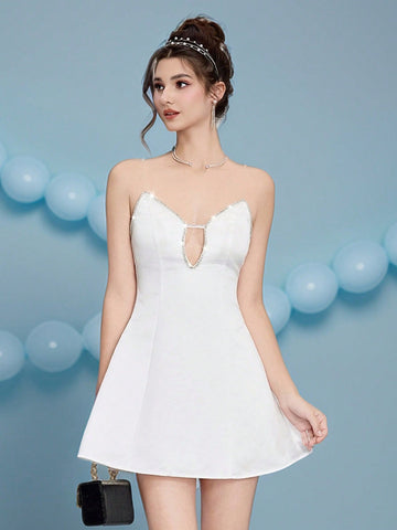 Make a grand entrance in this stunning strapless white dress, where timeless elegance meets sparkle! Delicate crystal embellishments dance across the bodice, catching light with every twirl and creating an enchanting shimmer that'll have everyone mesmerized. Perfect for walking down the aisle or ruling the prom dance floor, this gown combines classic sophistication with just the right amount of glamorous pizzazz. The clean, strapless silhouette flatters beautifully while those glittering details add the wow