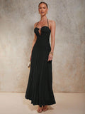 Slip into sophistication with this stunning dark blue halter maxi dress that's equal parts glamorous and fun. The sleek halter neckline frames your shoulders beautifully, while shimmering metal accents add just the right amount of sparkle to catch every eye in the room. Perfect for evening events, special occasions, or whenever you want to feel absolutely fabulous. The flowing maxi silhouette offers comfort without compromising on style, making this dress your go-to choice for turning heads with effortless 